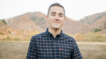 Christopher Pfledderer in front of mountains.