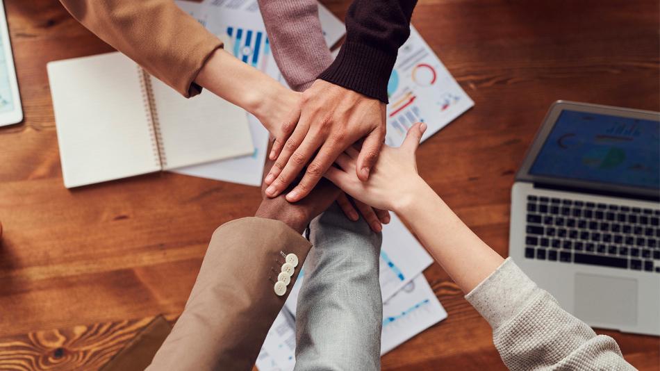 Team Hand-Stack gesture over desk