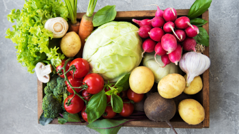 Photo of produce box filled with colorful fruits and vegetables.