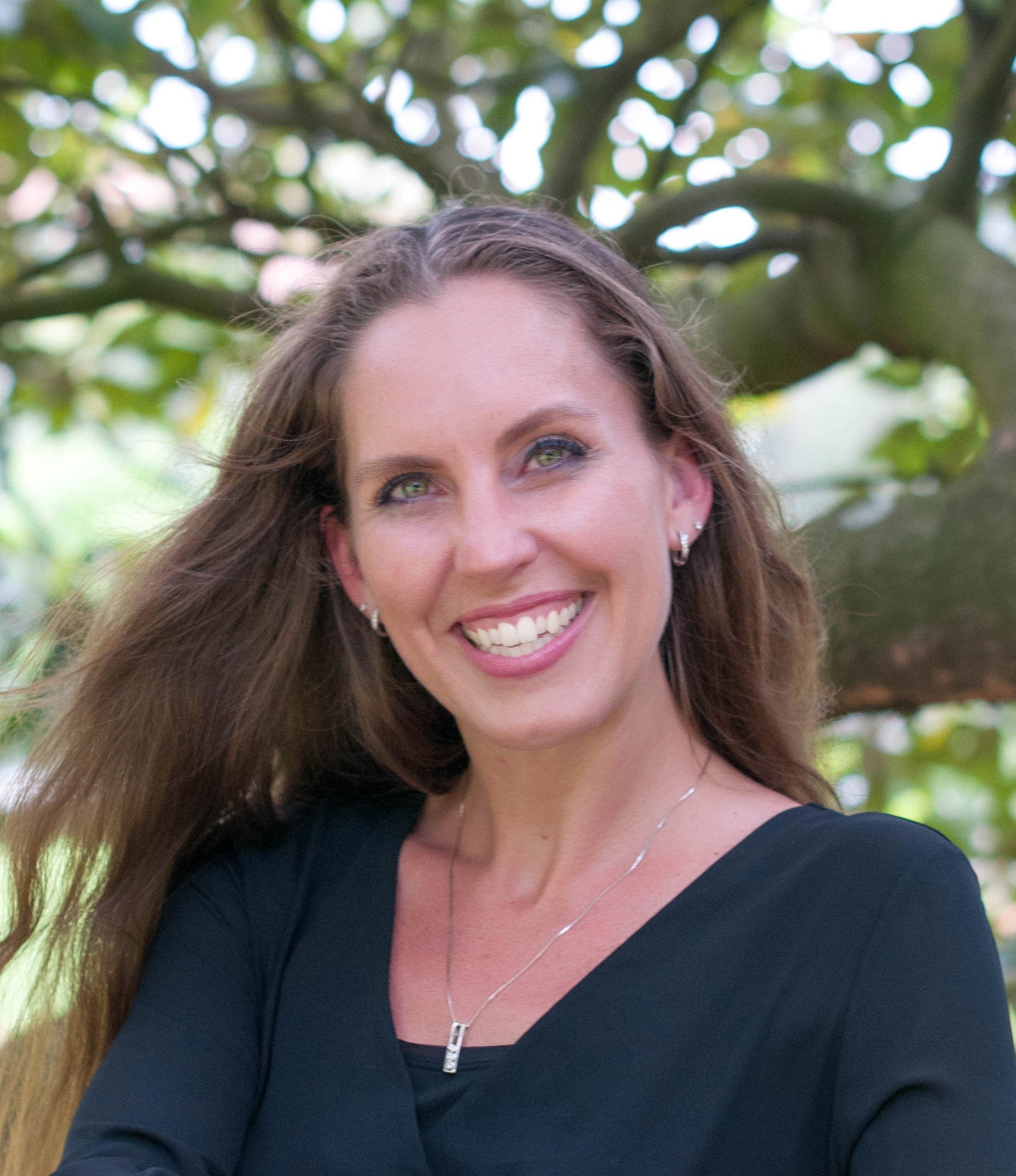 Heidi McPherson pictured in front of tree.