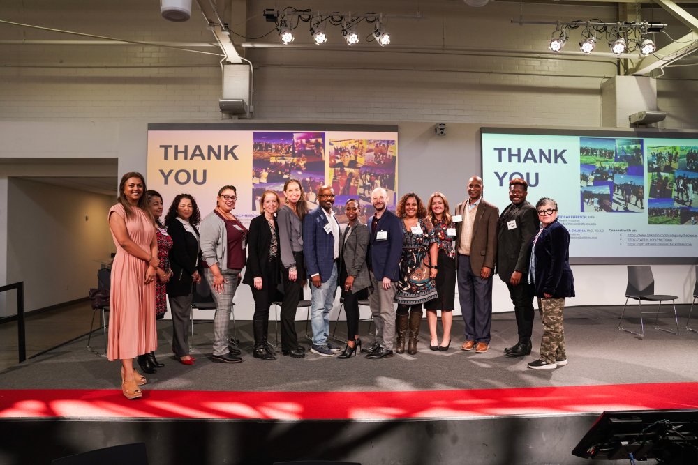 The Health Equity Collective pictured at their 5-year anniversary in-person quarterly meeting.