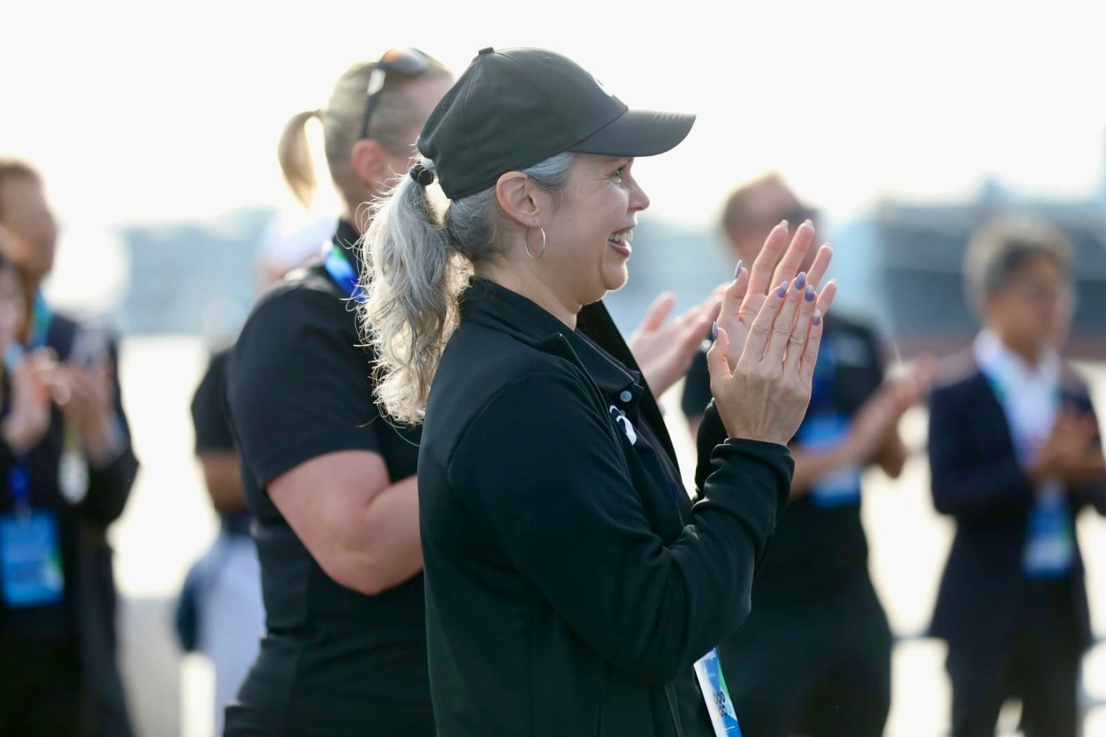 Gabriela Gallegos pictured clapping at Triathlon.