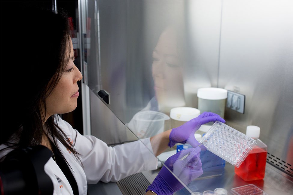 A woman in a lab with instruments. (UTHealth Houston file photo)