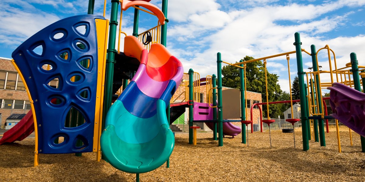 Colorful school playground with blue sky in background
