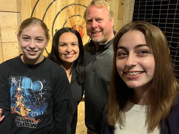 Melissa Valerio-Shewmaker, PhD, pictured with her husband, Troy, and stepdaughters, Abigail and Coral. (Photo courtesy of Melissa Valerio-Shewmaker, PhD).