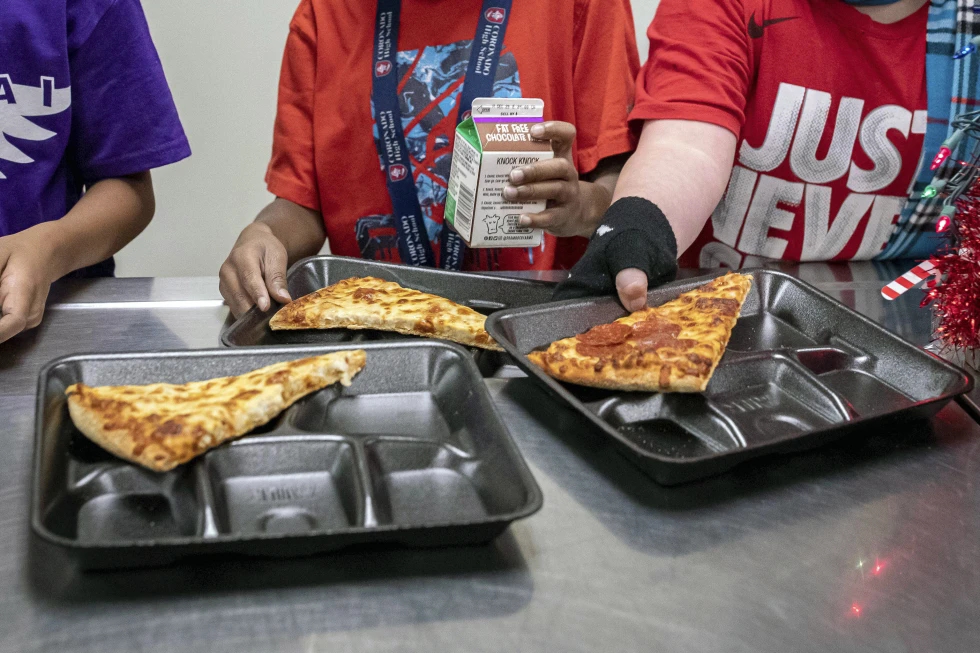 There’s a new push to put whole milk back in school meals. Here’s what you should know