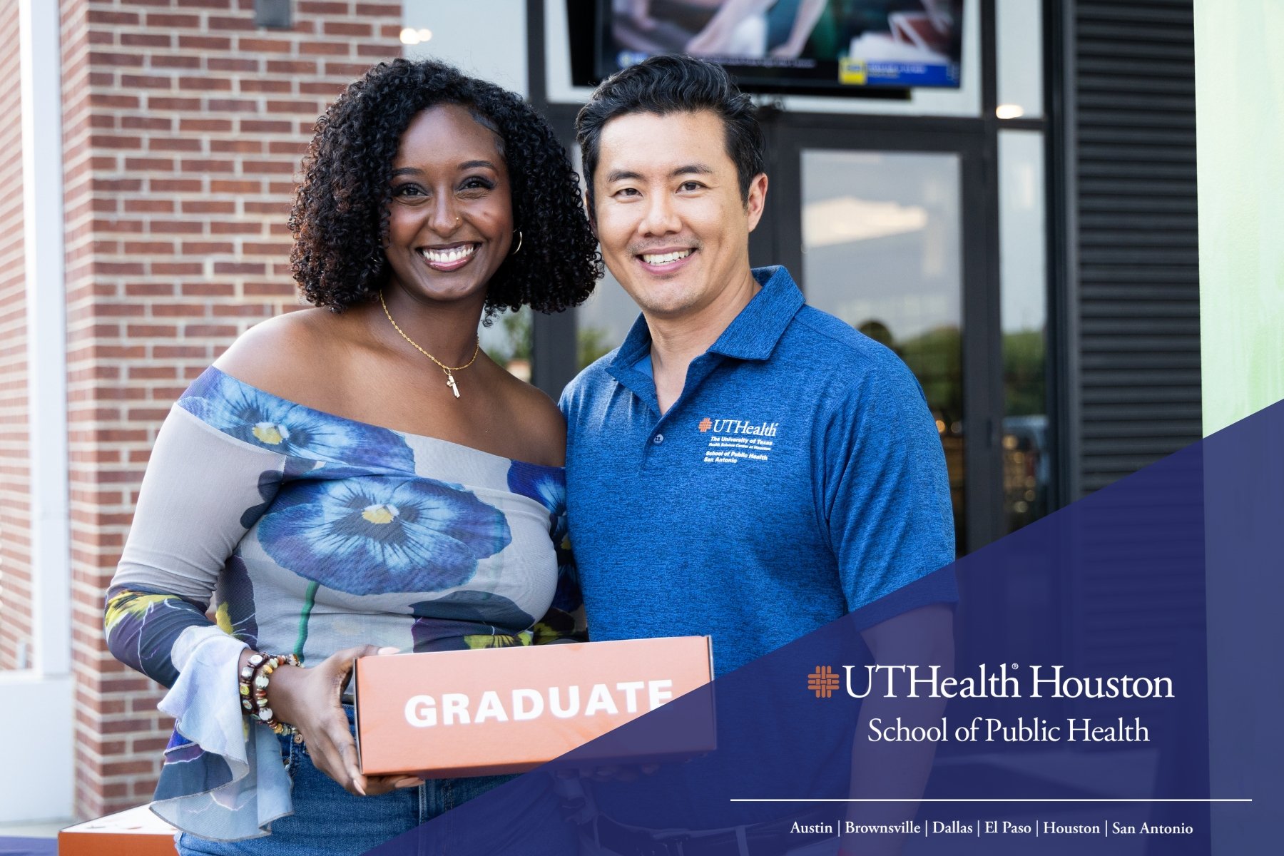 Kokeb Okbamichael, MPH, receives a graduation gift from Jack Tsai, PhD, professor and regional dean in San Antonio.