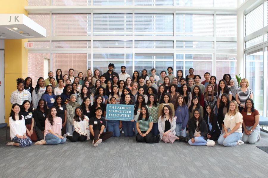 Group photo of The Albert Schweitzer Fellowship 2024 cohort, with students in middle holding The Albert Schweitzer Fellowship sign.