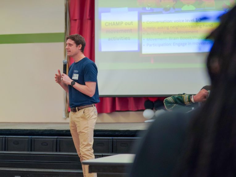 Principal investigator Timothy J. Walker, PhD leads an in-school training session.