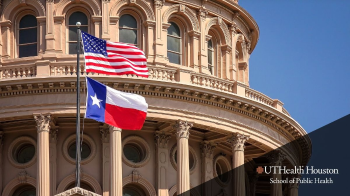 Texas Capitol Building with state flag and American Flag