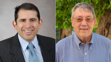 Doctors Absalon Gutierrez and Joseph McCormick posing side by side and smiling.