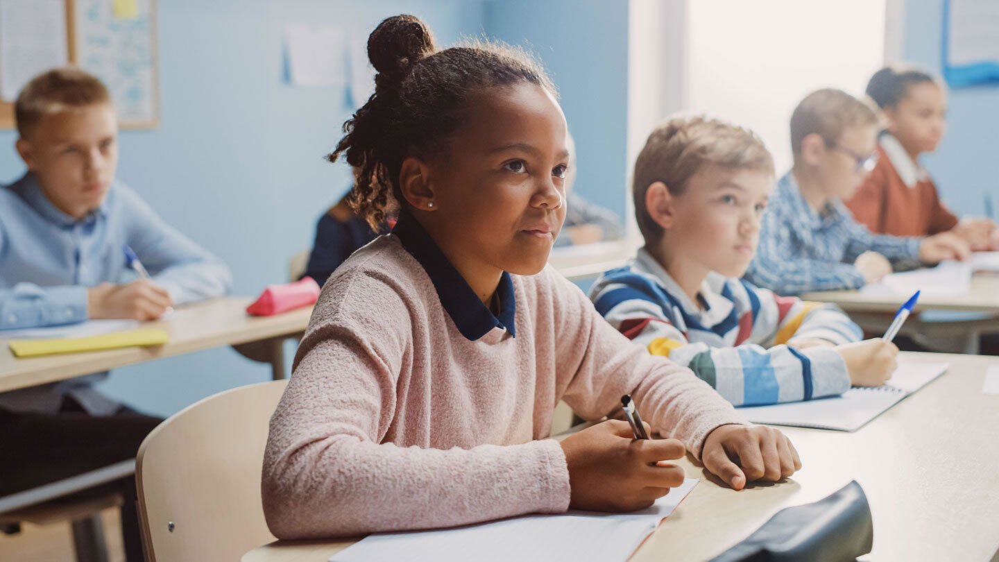 Students sitting at desks in a classroom.