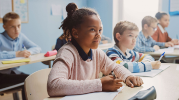 Students sitting at desks in a classroom.