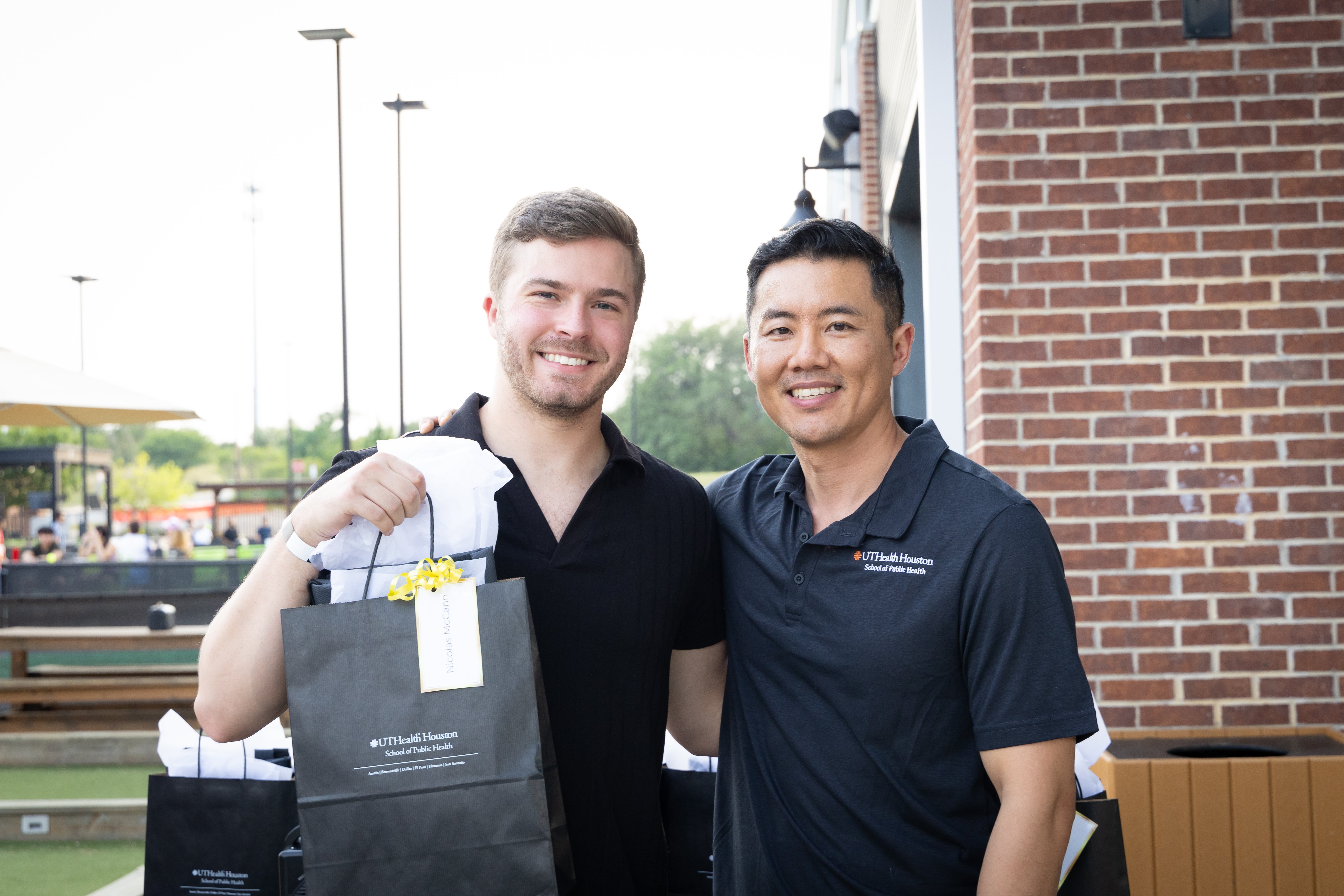 Nicholas McCann, MPH, at a graduation celebration in San Antonio with Jack Tsai, PhD, professor and regional dean at the San Antonio location.