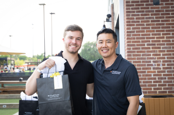 Nicholas McCann, MPH, at a graduation celebration in San Antonio with Jack Tsai, PhD, professor and regional dean at the San Antonio location.
