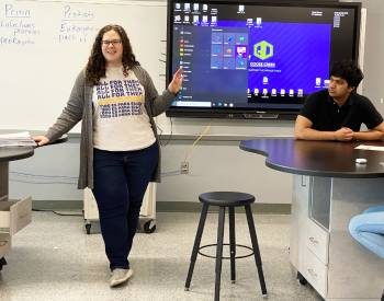 Ross S. Sterling High School senior Abdul Samad, right, listens as All for Them senior program manager Efrat Gabay, MPH talks to students about the clinic that would be held at the Goose Creek CISD campus.