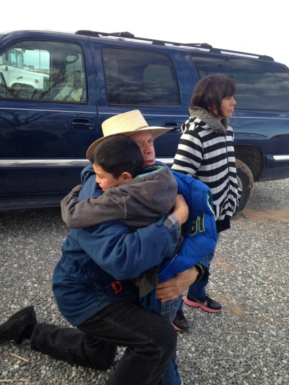 Arbol de Vida founders, John Walker and Carmen Yañez, greeting a young boy as he stepped off the bus at their center