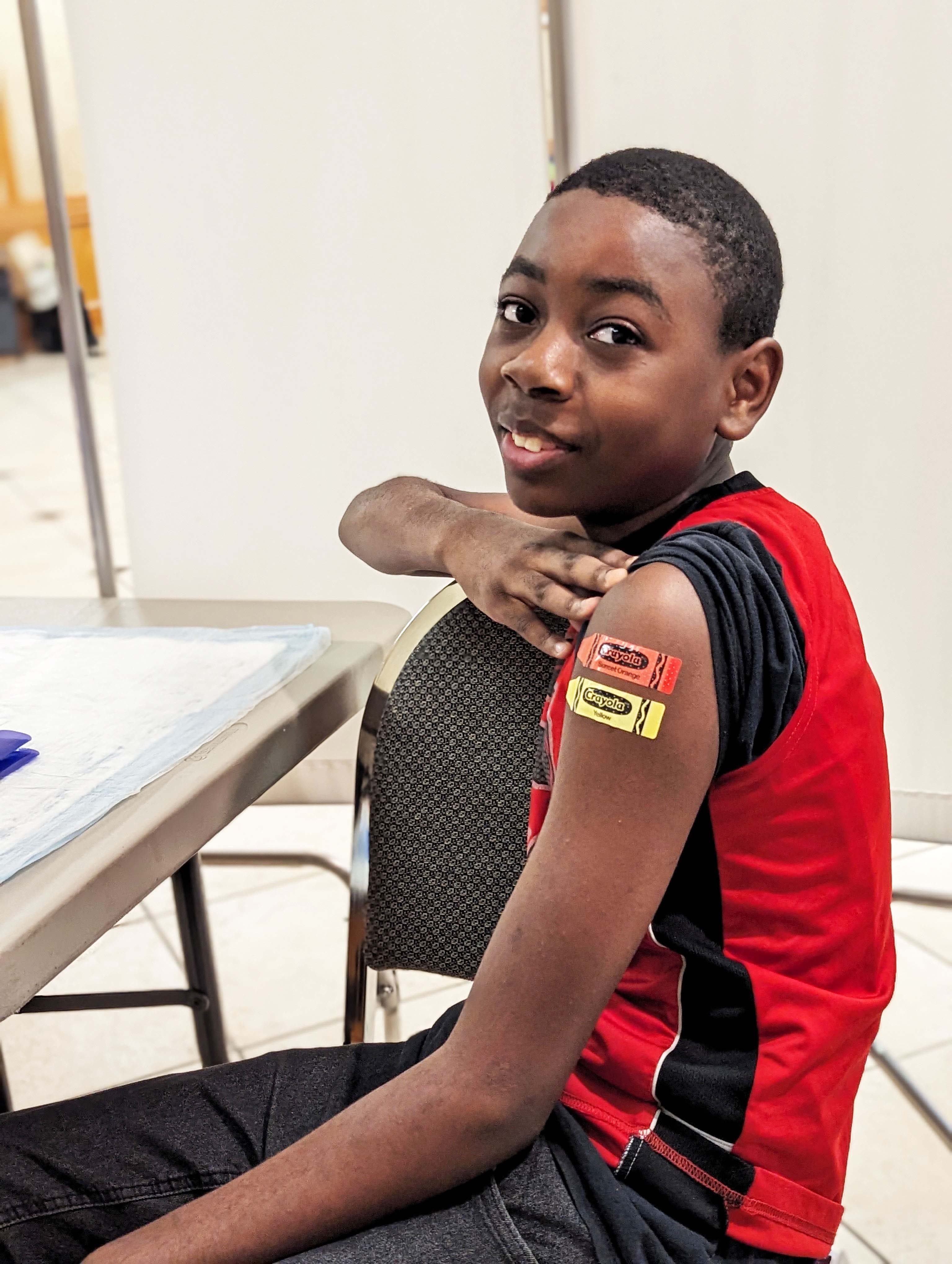 Aldine community clinic_kid with bandaids copy.jpg