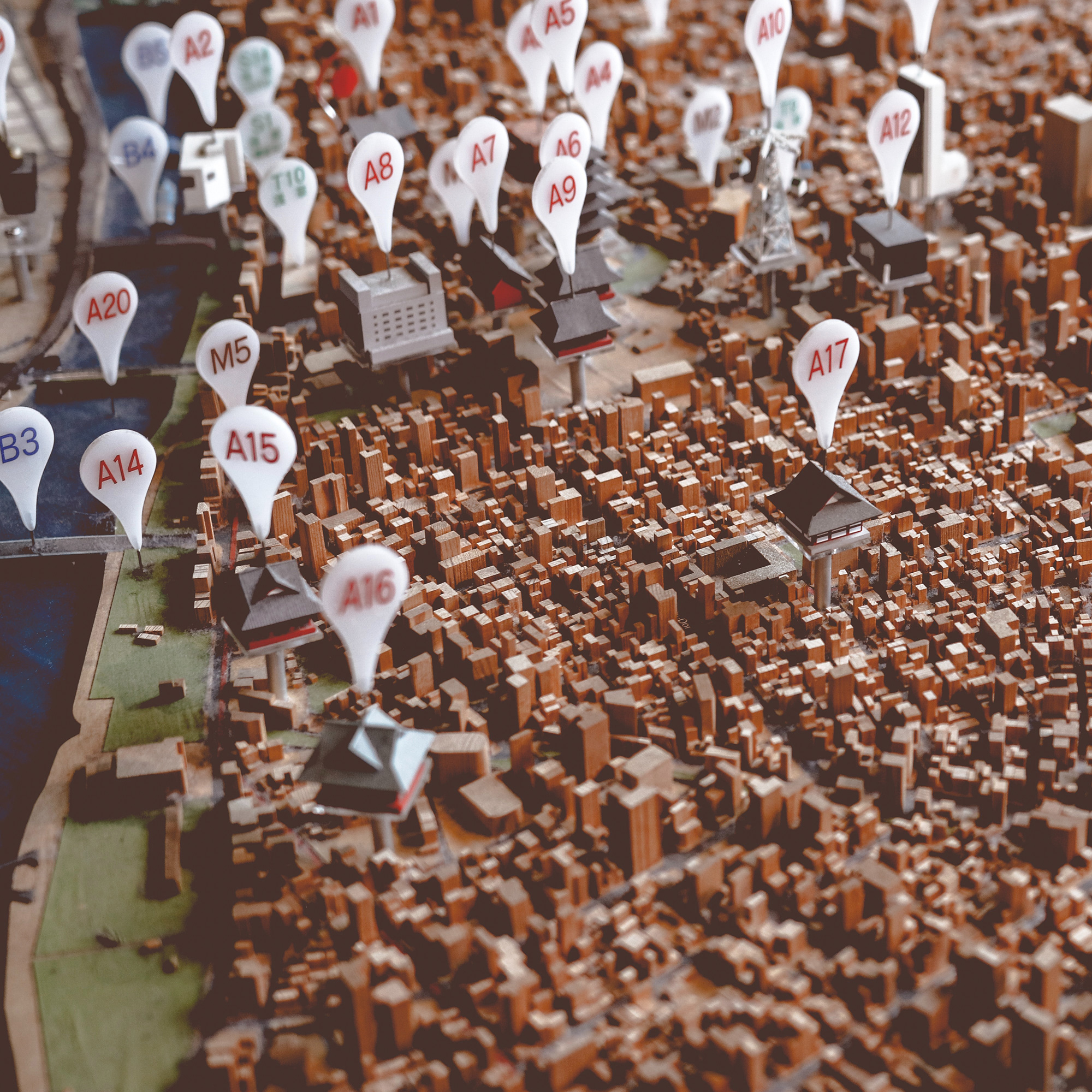 Mock up City 3D model with map pins on top of houses