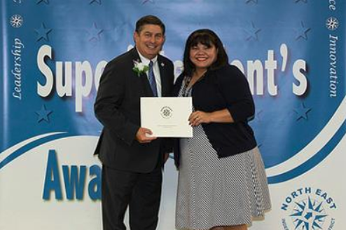 two people holding award