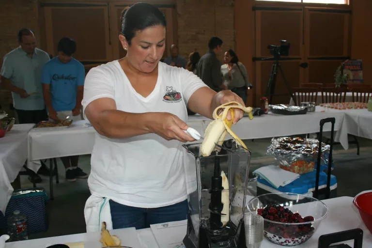 lady-adding-banana-to-blender